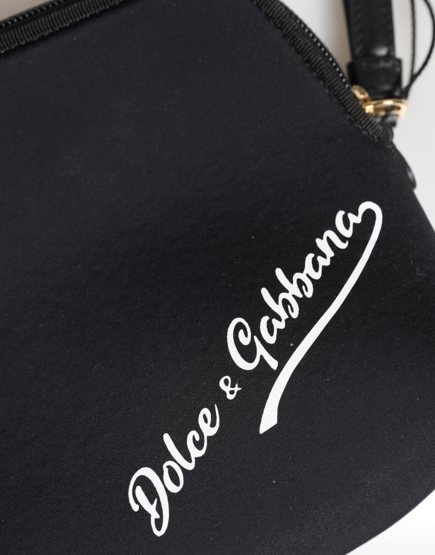 Dolce & Gabbana Schwarze, solide Nylon-Clutch mit DG-Logoprint und Reißverschlusstasche