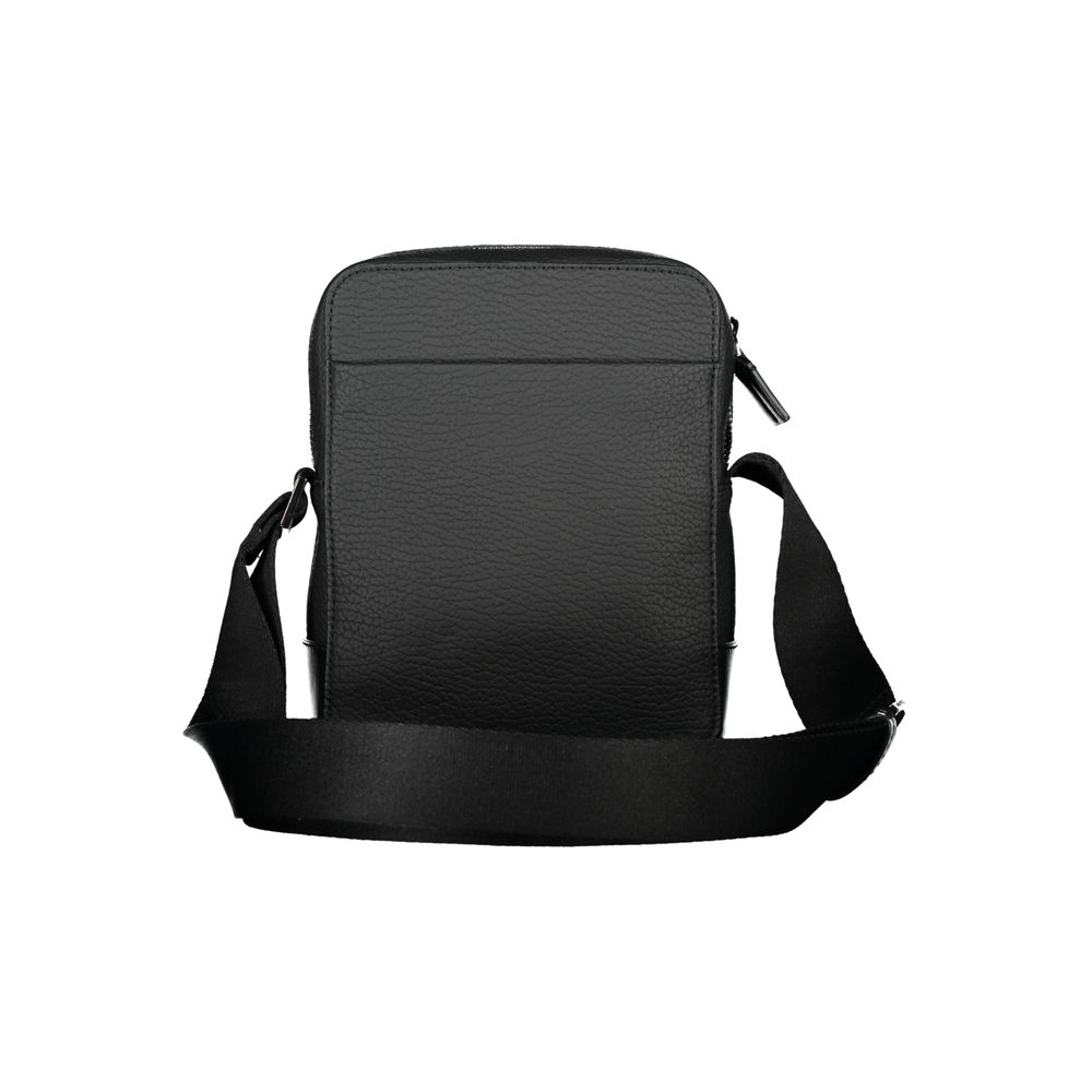 Calvin Klein – Elegante schwarze Umhängetasche mit kontrastierenden Details